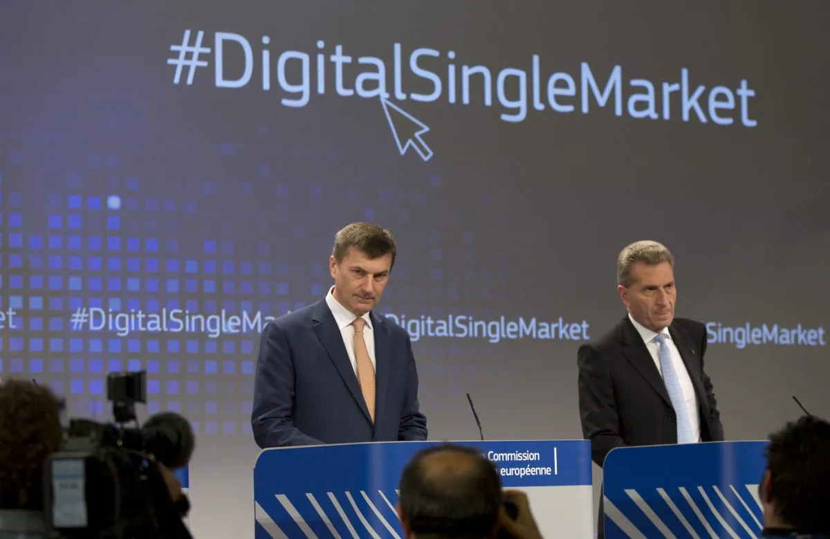 European Commissioner for Digital Single Market Andrus Ansip, (L) uropean Commissioner for Digital Economy Guenther Oettinger participate in a media conference at EU headquarters in Brussels on Wednesday.  (AP Photo/Virginia Mayo)