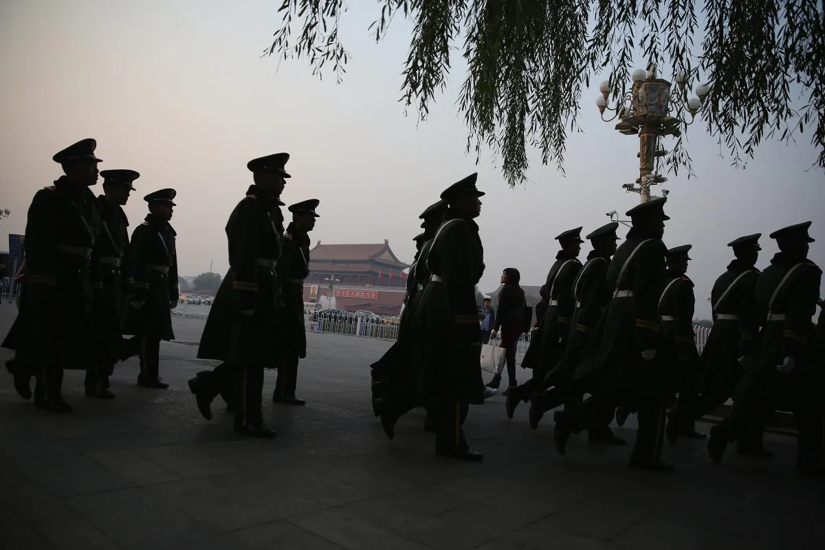 Paramilitary policemen patrol at Tiananmen Square on November 8, 2013 in Beijing, China. (Feng Li/Getty Images)