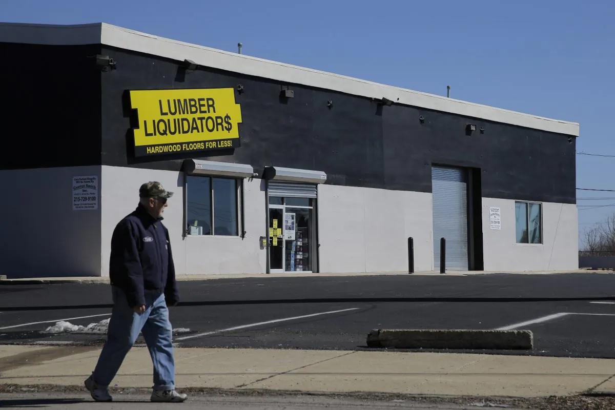 A man walks past a Lumber Liquidators store, Thursday, March 12, 2015, in Philadelphia. (AP Photo/Matt Slocum)
