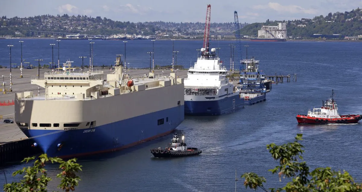 Ships sit moored at Seattle's Terminal 5, including the Royal Dutch Shell support vessel Aiviq (C), on May 6, 2015. (Elaine Thompson/AP)