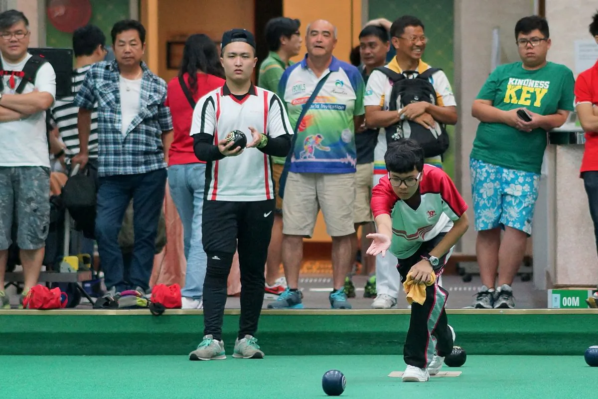 Yan Oi Tong Tin Ka Ping Secondary School skipper Lyndon Sham maintains his concentration in the final of the Hong Kong Inter-schools Lawn Bowls Competition on Friday May 1 against Yan Chai Hospital No.2 Secondary School to win their second title in three years. (Mike Worth)