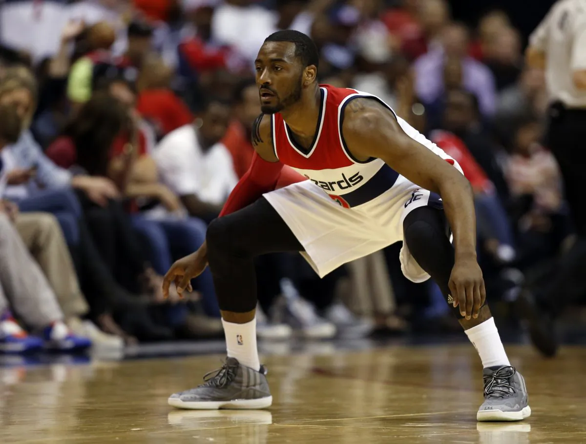 Washington Wizards guards John Wall (2) stands ready in the second half of Game 4 in the first round of the NBA basketball playoffs against the Toronto Raptors, Sunday, April 26, 2015. (AP Photo/Alex Brandon)