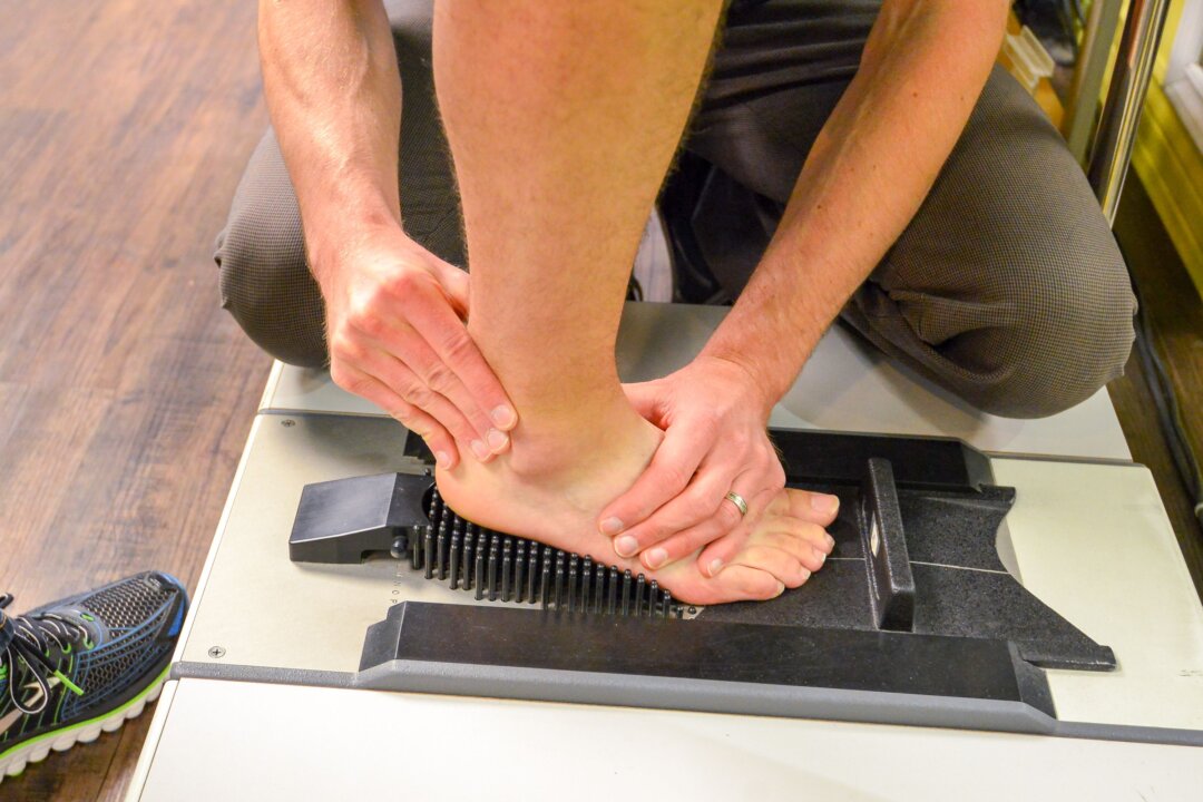 A Foot Solutions customer receives a complimentary foot and gait analysis by a foot specialist to determine a good fit. (Foot Solutions)
