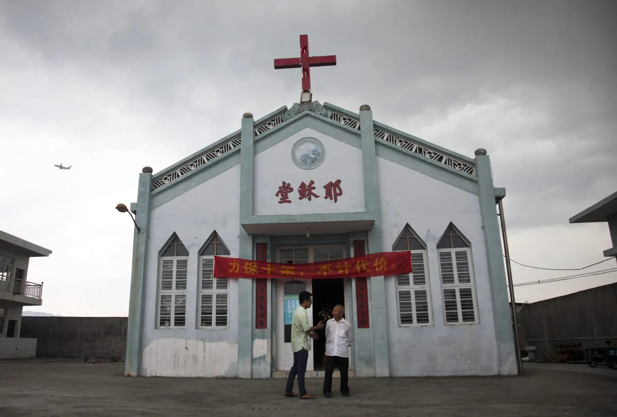 Wuxi Christian Church with the words "Church of Jesus" in red, in Longwan, Wenzhou in eastern China's Zhejiang province. (AP Photo/Didi Tang)