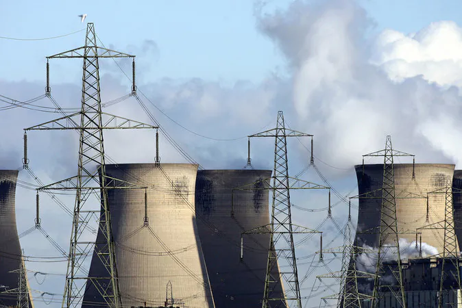 Steam rises from the eight cooling towers at the Ferrybridge power station near Leeds, in the north of England, on Oct. 30, 2006. (Paul Ellis/AFP/Getty Images)