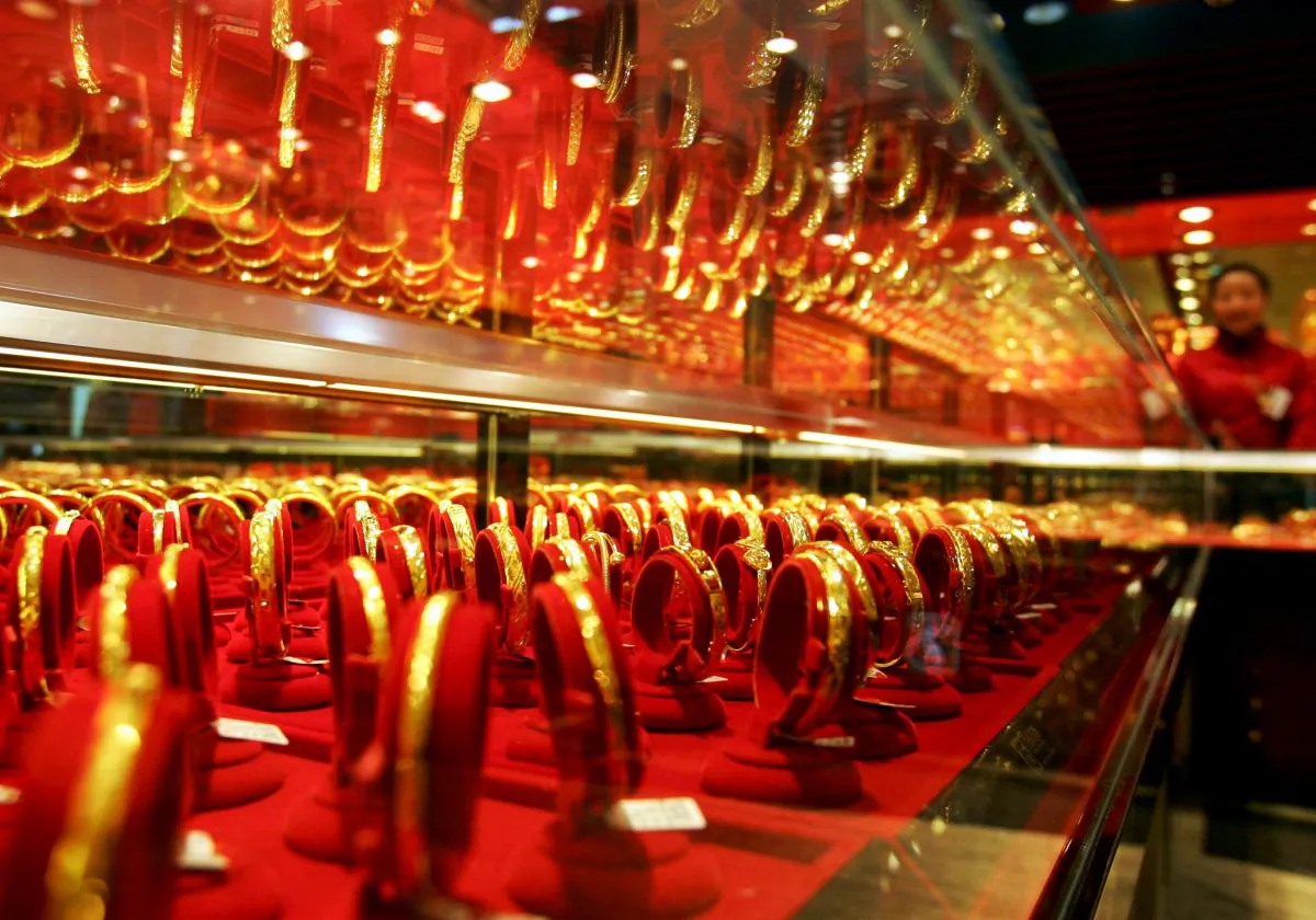Golden bracelets on display in a jewellery shop in Whuan, China, Jan. 9, 2008. Chinese have always valued gold and now want to take control of the physical price. (China Photos/Getty Images)