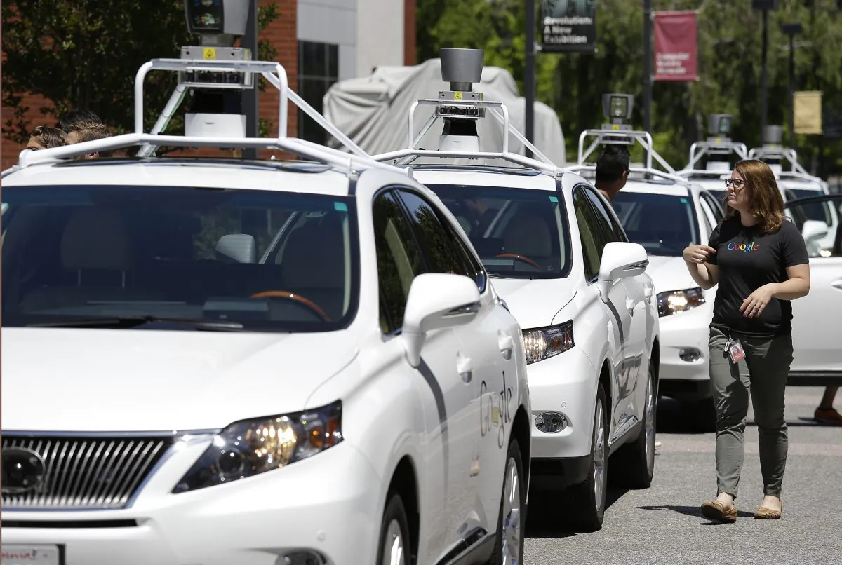 A row of Google self-driving Lexus cars outside the Computer History Museum in Mountain View, Calif., on May 13, 2014. (Eric Risberg/AP)