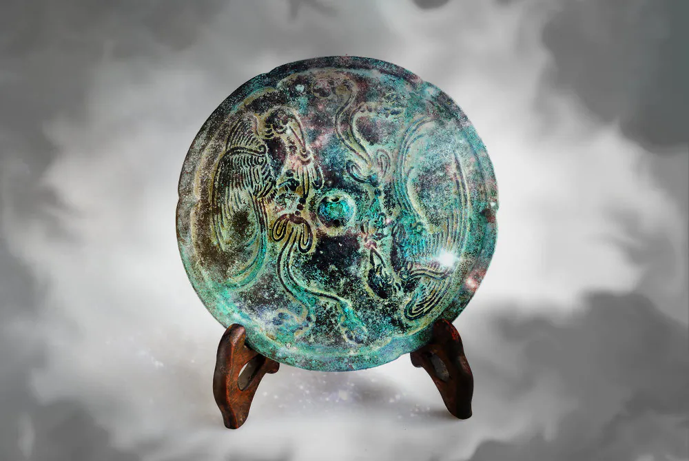 Many bronze mirrors of ancient China and Japan, like this one, functioned normally. But in rare cases, they had the strange property of seeming both solid and transparent at the same time! (Shutterstock*; edited by Epoch Times)