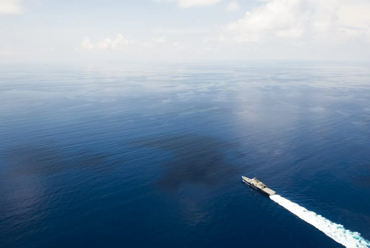 The littoral combat ship USS Fort Worth conducts patrols in international waters of the South China Sea near the Spratly Islands. The patrol may be the first of many, as the U.S. considers enforcing freedom of transit in the region. (U.S. Navy photo by Mass Communication Specialist 2nd Class Conor Minto/Released)