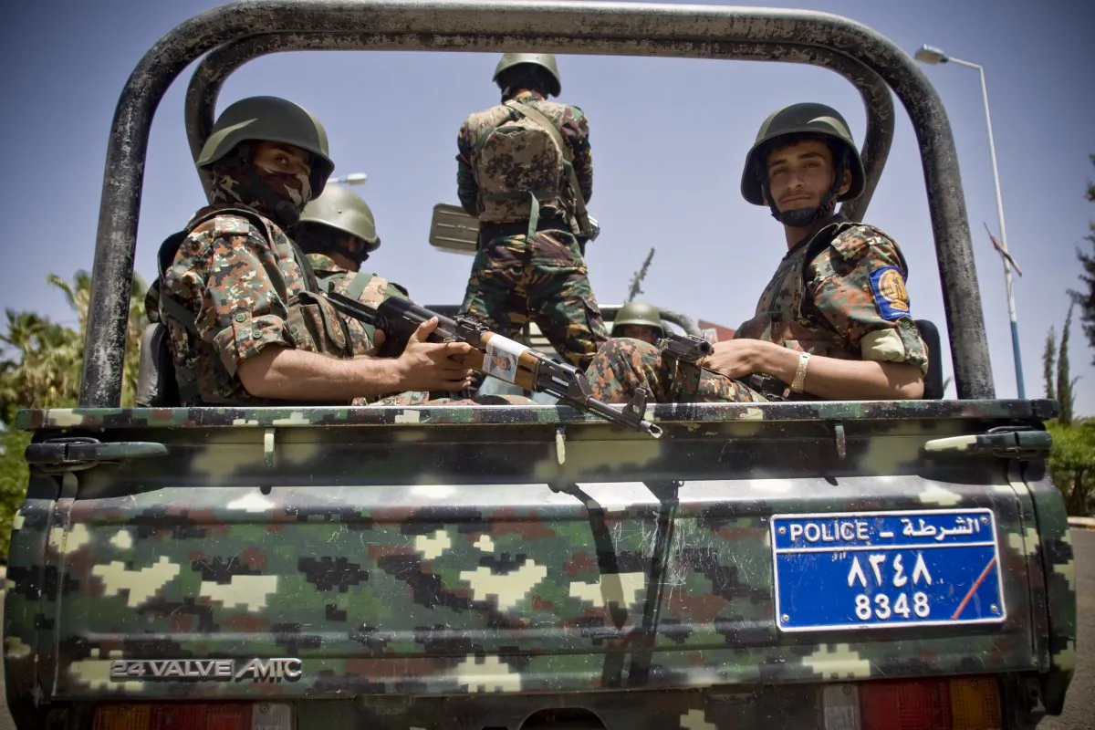 Shiite fighters, known as Houthis, wearing army uniforms escort the convoy of Ismail Weld al-Sheikh, new U.N. special envoy to Yemen, at the international airport in Sanaa, Yemen, Tuesday, May 12, 2015. Warplanes from a Saudi-led coalition kept up their airstrikes targeting the positions of Yemen's Shiite rebels and their allies around the capital, Sanaa, hours ahead of a humanitarian cease-fire set to begin on Tuesday evening. (AP Photo/Hani Mohammed)