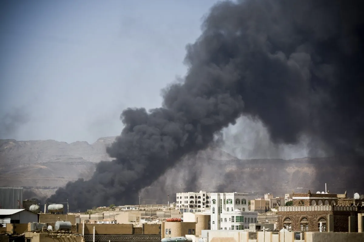 Smoke rises after a Saudi-led airstrike hit a site believed to be a munitions storage, in Yemen's capital, Sanaa, on Tuesday, May 12, 2015. (AP Photo/Hani Mohammed)