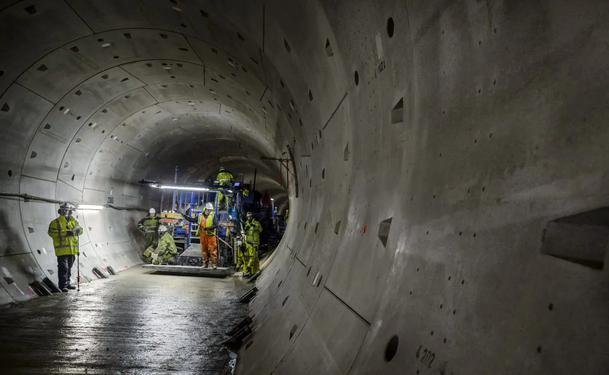 Employees make a flat bottom in the round tunnels of the North/South subway line with a pavermachine in Amsterdam, on February 5,2014. (LEX VAN LIESHOUT/AFP/Getty Images)