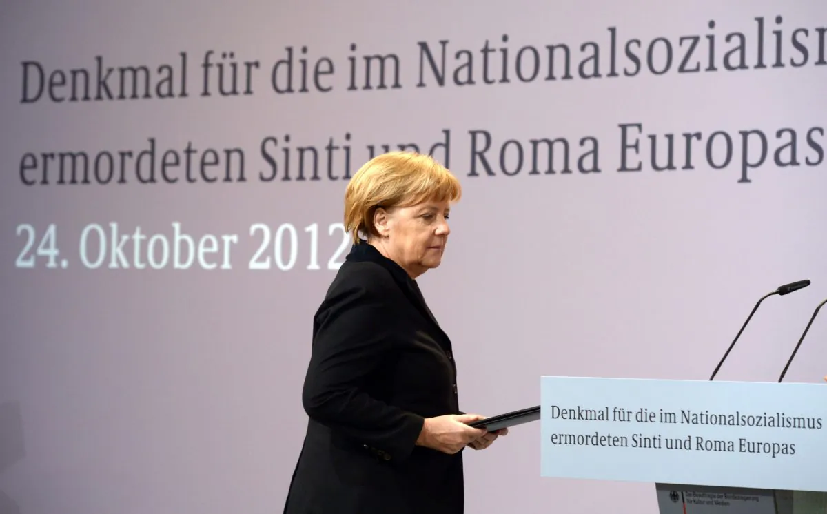 German Chancellor Angela Merkel arrives to deliver her speech during the unveiling ceremony of the memorial to the Roma and Sinti victims of the Nazi Holocaust during World War II, in Berlin Oct. 24, 2012. Recognition of Roma persecution has been rare. (RAINER JENSEN/AFP/Getty Images)