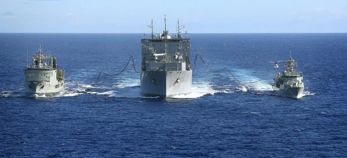 Australian naval ships replenish a United States Navy ship in the South Indian Ocean during the search for missing Malaysia Airlines Flight MH370 on April 12, 2014. Australia is considering sending navy ships to help challenge the Chinese regime's claims in the South China Sea. (LSIS James Whittle/Australia Department of Defense via Getty Images)