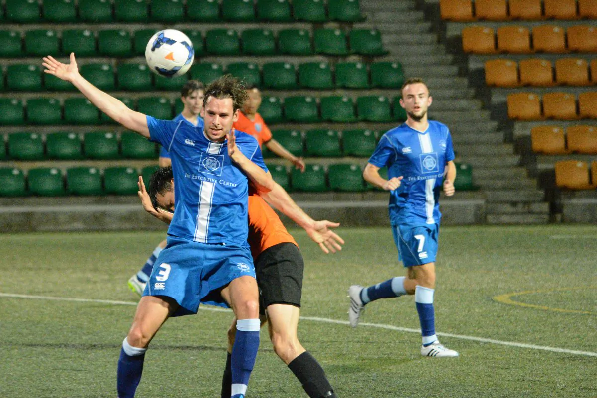 HKFC (Blue) and Kwun Tong players challenge for the ball in the penultimate HKFA Division 1 match at Sports Road on Sunday May 16, 2015. (Eddie So)