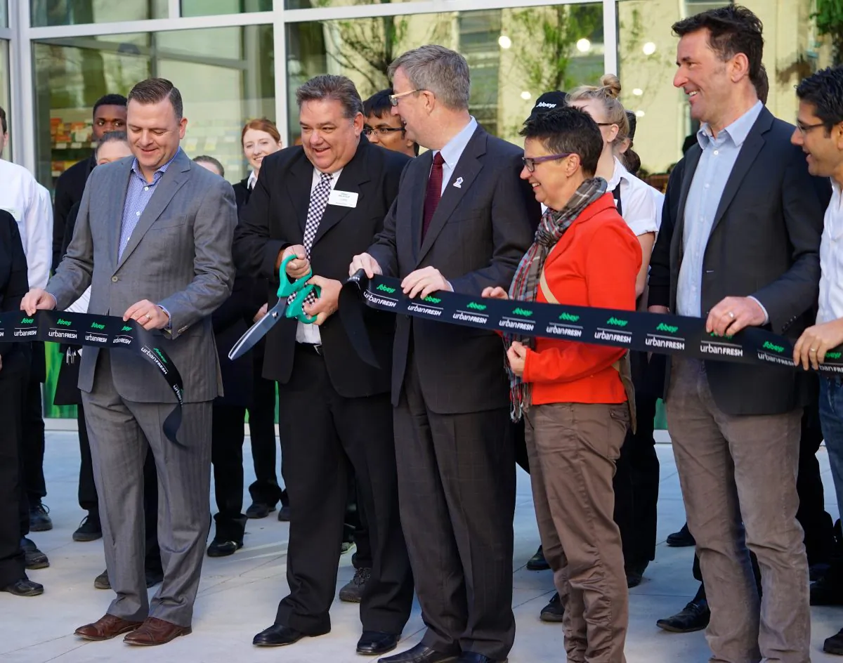 Preparing to cut the ribbon at the opening of Sobeys in downtown Ottawa on May 22, 2015, are from left to right: Ottawa Food Bank executive director Michael Maidment, store manager John Leblanc, Ottawa Mayor Jim Watson, councillor Catherine McKenney, MP Paul Dewar, and MPP Yasir Naqvi. (Pam McLennan/Epoch Times)