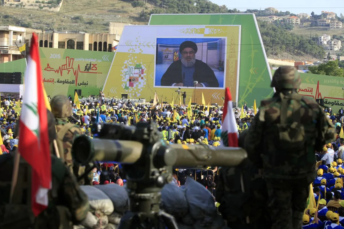 Hezbollah fighters stand guard as Hezbollah leader Sheikh Hassan Nasrallah (C) delivers a speech in a file photo (AP Photo/Mohammed Zaatari)