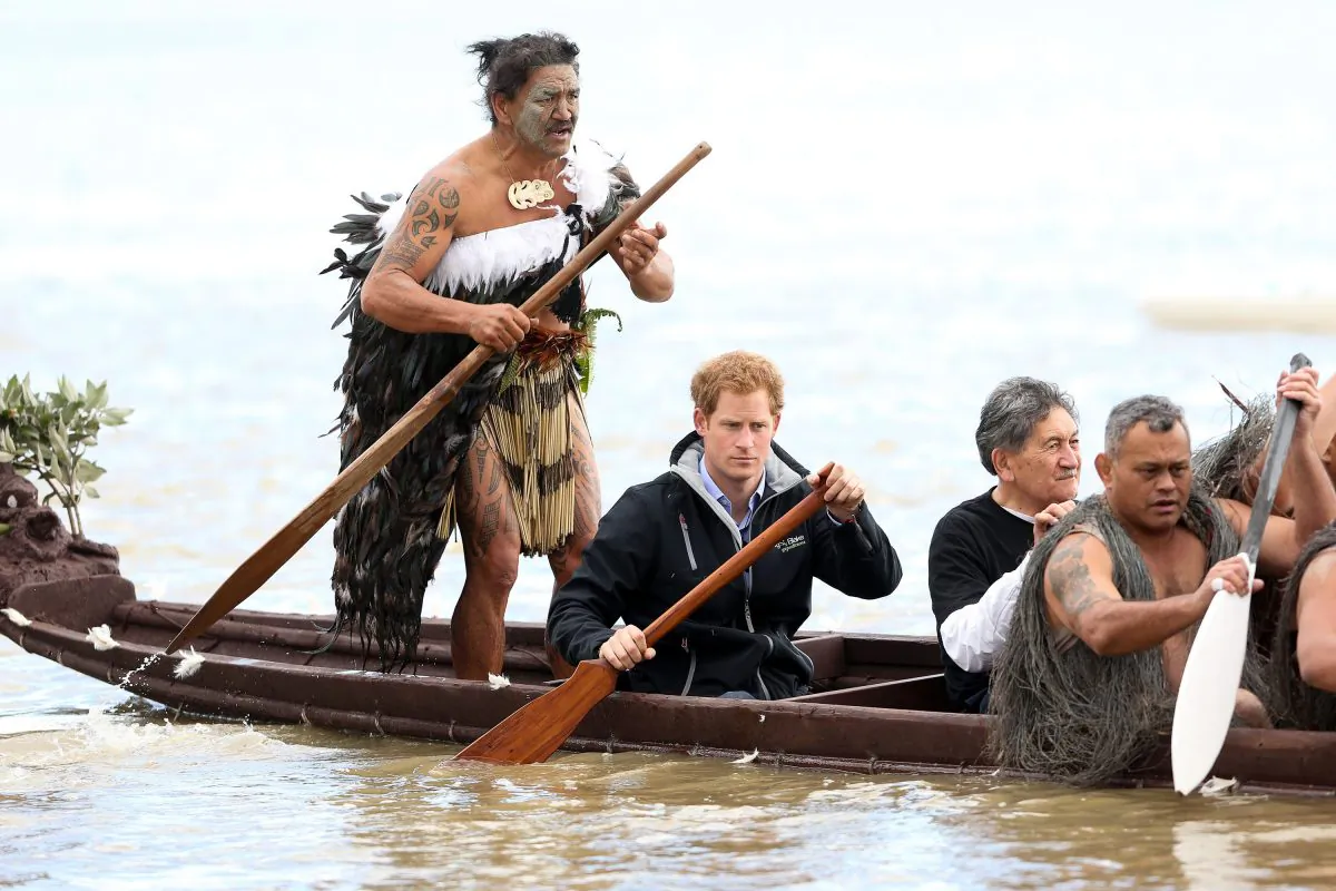 Ned Tapa and Prince Harry paddle a waka down the Whanganui River after a visit to Putiki Marae on May 14, 2015 in Wanganui, New Zealand. Prince Harry is in New Zealand from May 9 through to May 16 attending events in Wellington, Invercargill, Stewart Island, Christchurch, Linton, Whanganui and Auckland. (Hagen Hopkins/Getty Images)