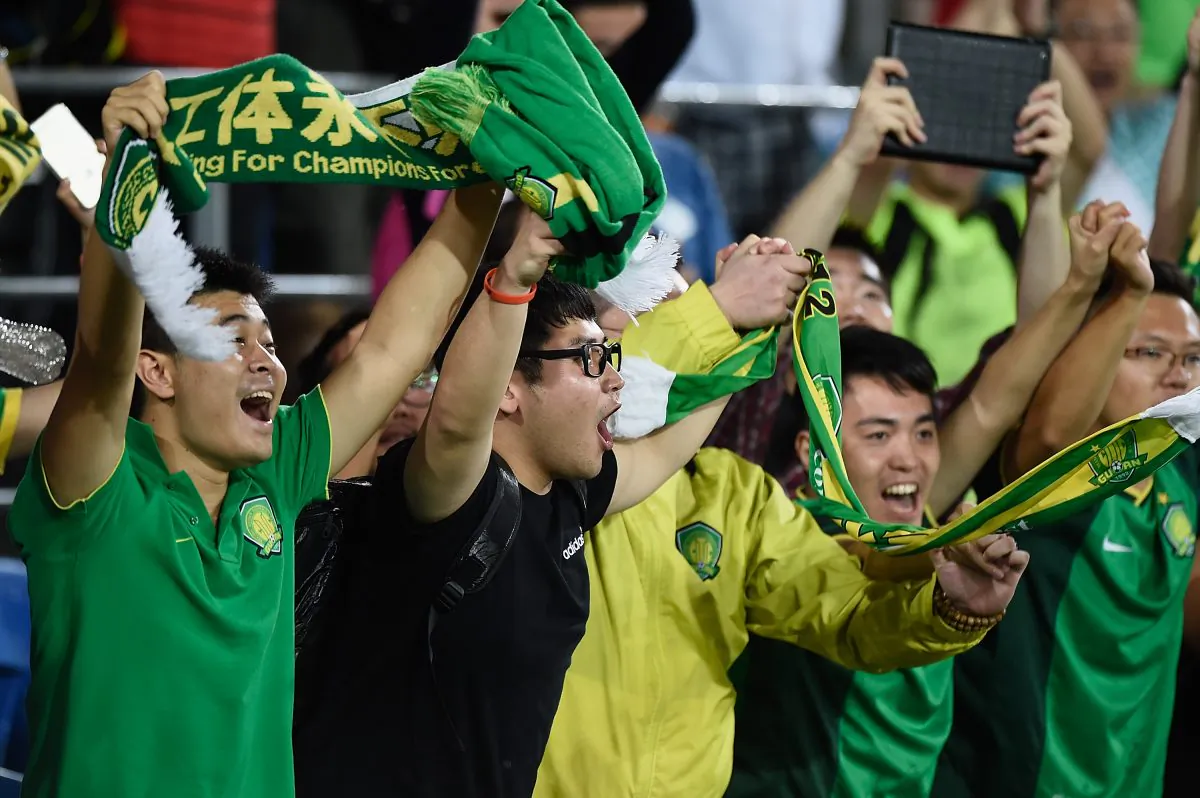 Fans of Beijing Guoan celebrate victory during the AFC Asian Champions League match between Brisbane Roar and Beijing Guoan at Cbus Super Stadium on February 25, 2015 on the Gold Coast, Australia. (Matt Roberts/Getty Images)