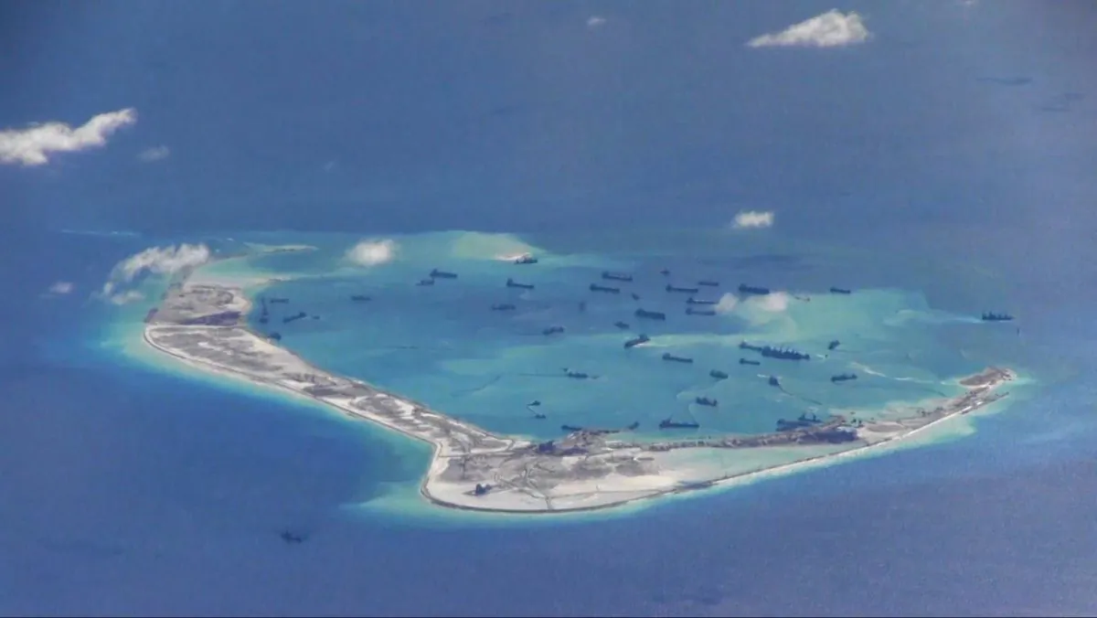 Chinese dredgers work on the construction of artificial islands on and around Michief Reef in the Spratly Islands of the South China Sea on May 2, 2015. (U.S. Navy)