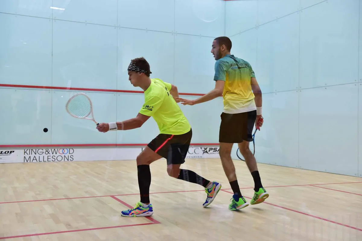 Laurens Jan Anjema (on strike) plays a forehand during his 1st round battle with Declan James in the HKFC Meco PSA 25 tournament at the Hong Kong Football Club on Wednesday May 27, 2015. (Bill Cox/Epoch Times) 