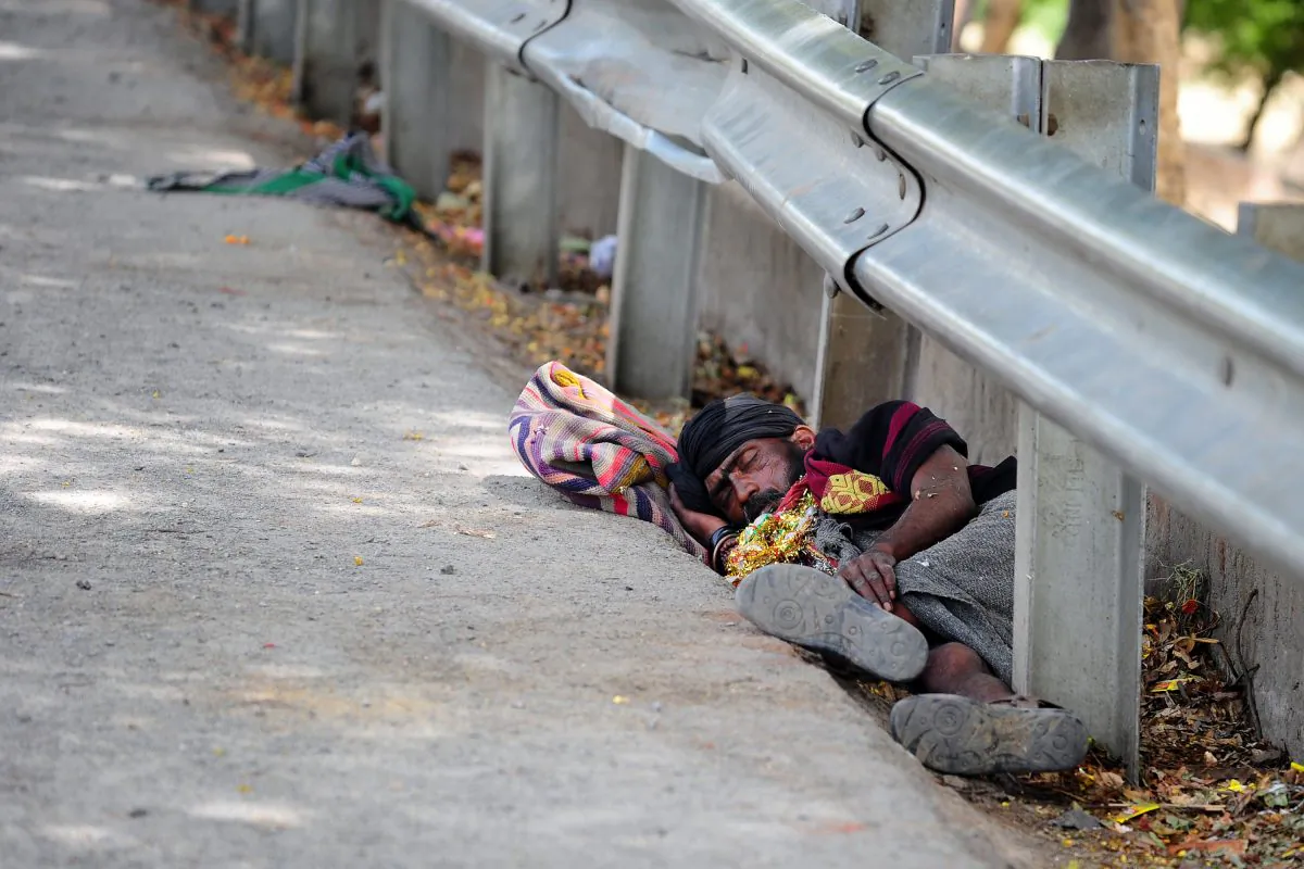 An Indian man rests on the road side during a hot summer day in Allahabad on May 22, 2015. (Sanjay Kanojia/AFP/Getty Images)