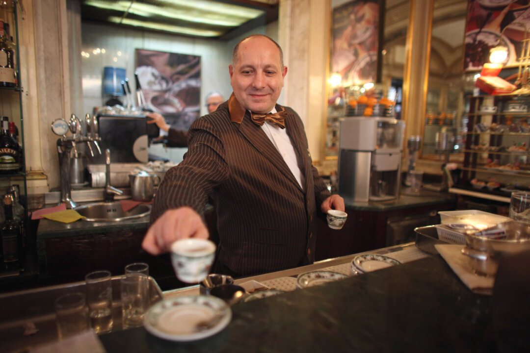 A barista serves coffee in Gran Caffe Gambrinus on November 16, 2011 in Naples, Italy. (Christopher Furlong/Getty Images)