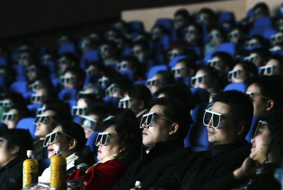 Audience members watch a movie through 3D glasses at a newly opened IMAX theatre on February 8, 2007 in Wuhan of Hubei Province, China.  IMAX plans to sell shares of its China unit in Hong Kong. (China Photos/Getty Images)
