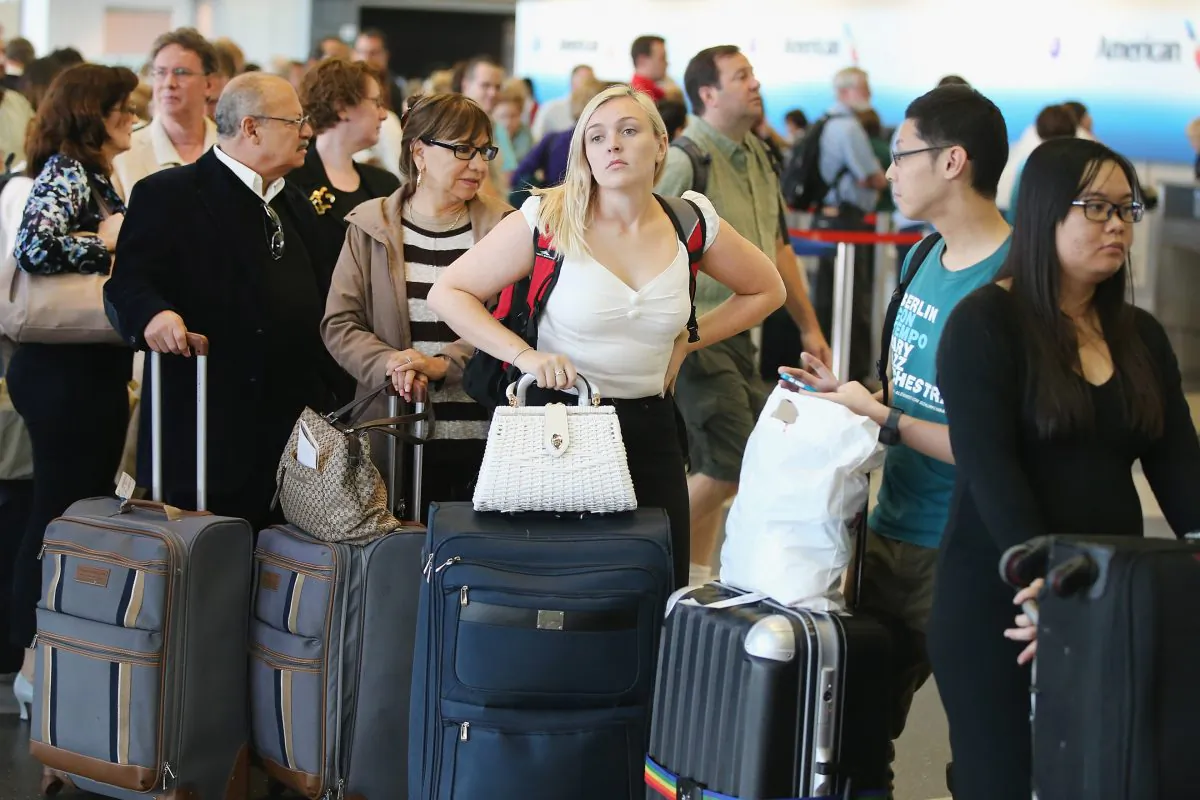 Passengers wait in line at the O'Hare International Airport in Chicago on on Sept. 26, 2014. (Scott Olson/Getty Images)