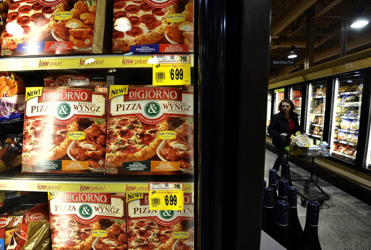 A woman shops in the frozen foods aisle at a Wegmans supermarket in Fairfax, Virginia, on February 24, 2011. (Photo credit should read Jewel Samad/AFP/Getty Images)