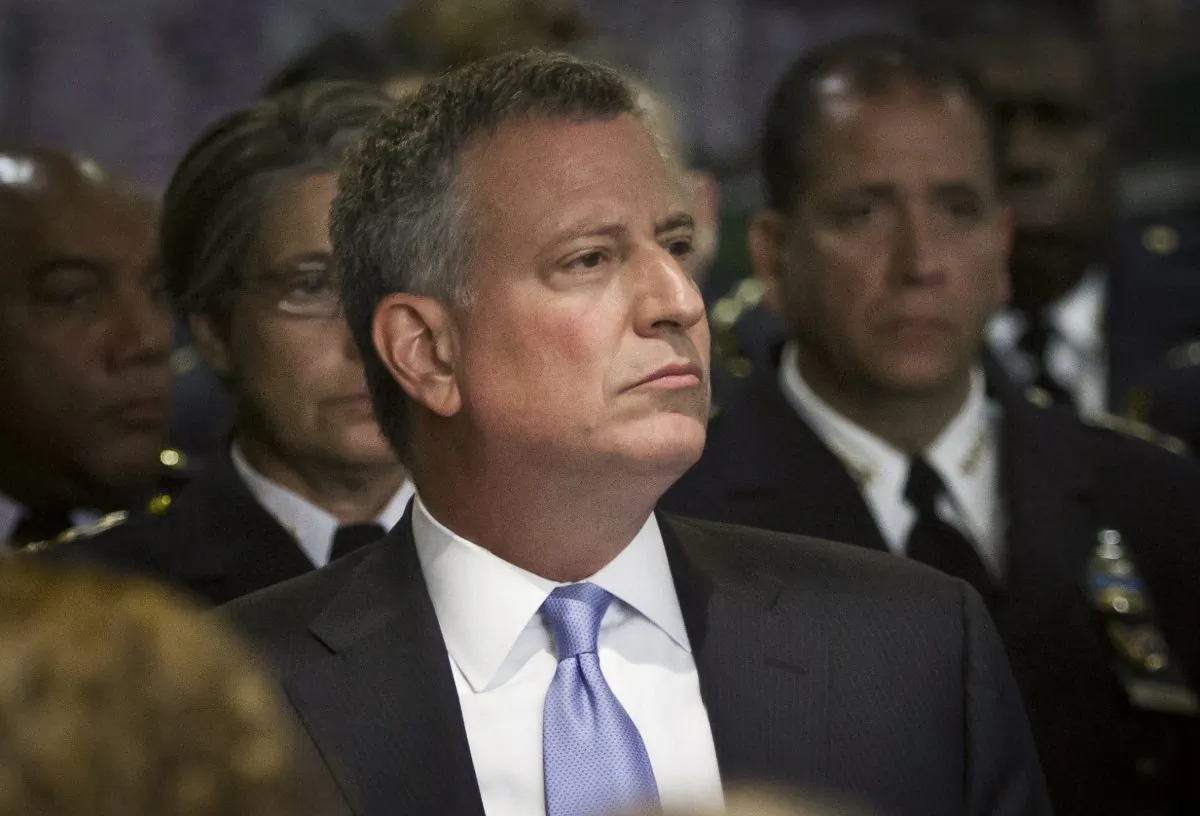 New York Mayor Bill de Blasio listens during a memorial ceremony for deceased members of the New York City Police Department, Thursday, May 7, 2015, at police headquarters in New York. (AP Photo/Bebeto Matthews)