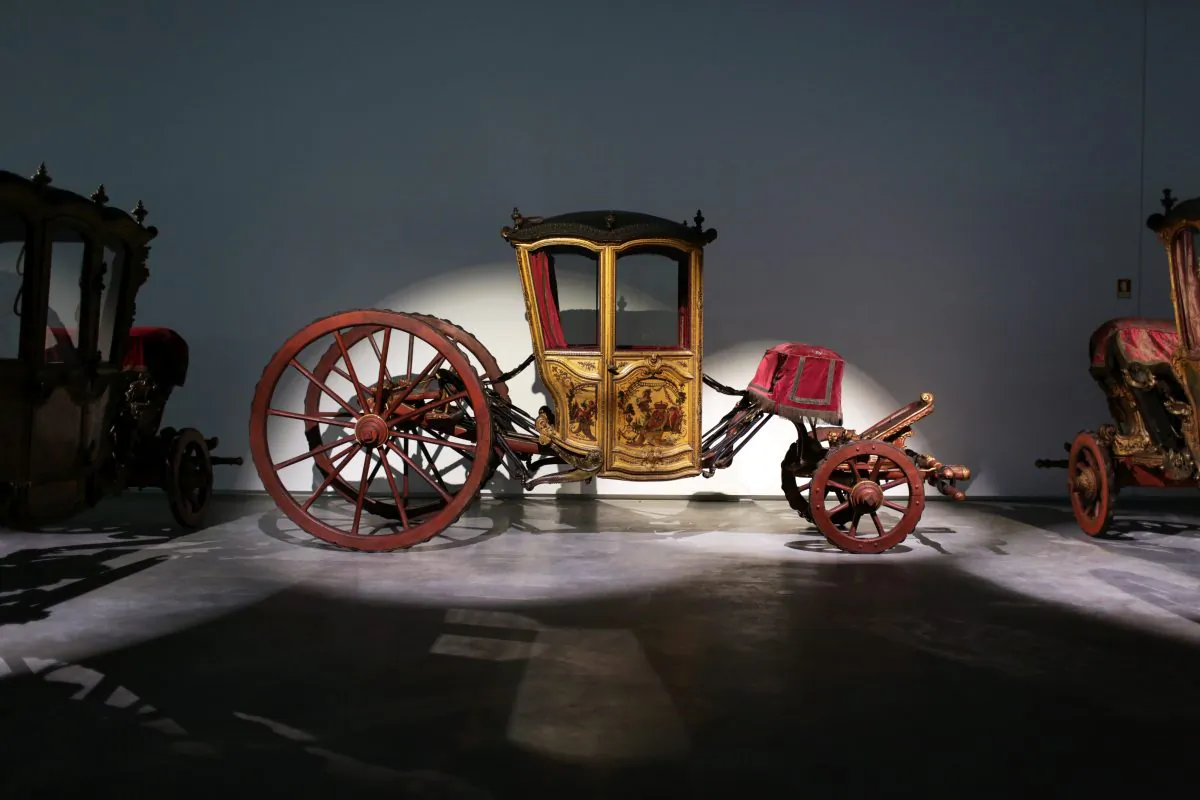 In this May 14, 2015 photo, an 18th Century coupe coach, ordered by Portuguese King Joao V for his sons, is displayed at the new building of the National Coach Museum in Lisbon. (AP Photo/Armando Franca)