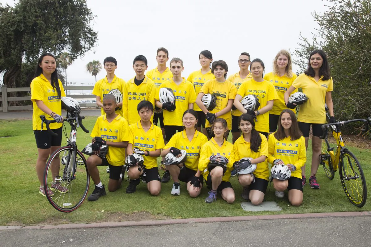 “Youth Ambassadors” from more than 10 countries pose for a photo before a rally Sunday, May 31, 2015. They are cyclists for Ride to Freedom, a group of 30 young people who will bike from Los Angeles to Washington, D.C., and finally New York on a 3,000 mile trip to ultimately rescue five orphans in China whose parents were killed because of their beliefs.