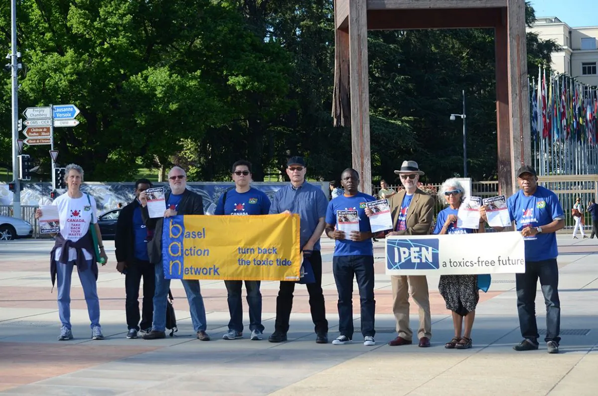 Members of Basel Action Network, IPEN, and other groups protest outside a conference related to the Basel Convention in Geneva, Switzerland, on May 10, 2015 over household waste shipped to the Philippines from Canada. The groups want Canada to take back the containers, which they say violates the Basel Convention. (John Wickens/IPEN)