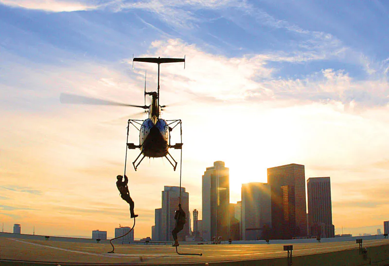 FBI Hostage Rescue Team rappelling from helicopter. (Courtesy FBI)