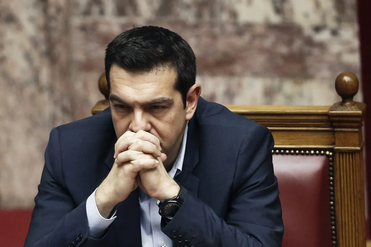 Greece's Prime Minister Alexis Tsipras, gestures during a parliament session before the conference vote in Athens, on Tuesday, Feb. 10, 2015. (AP Photo/Petros Giannakouris)