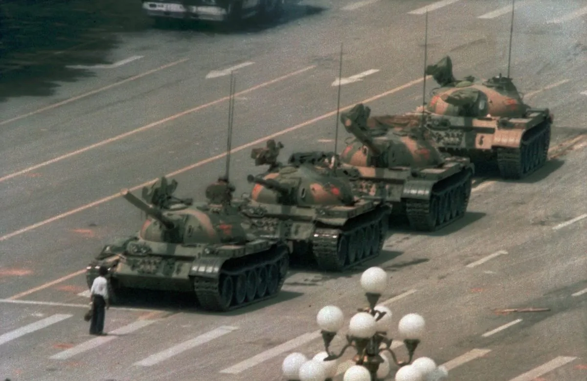 A Chinese man, now known as "Tank Man," stands alone to block a line of tanks heading east on Beijing’s Avenue of Eternal Peace during the Tiananmen Square Massacre, on June 5, 1989. (Jeff Widener/AP Photo)