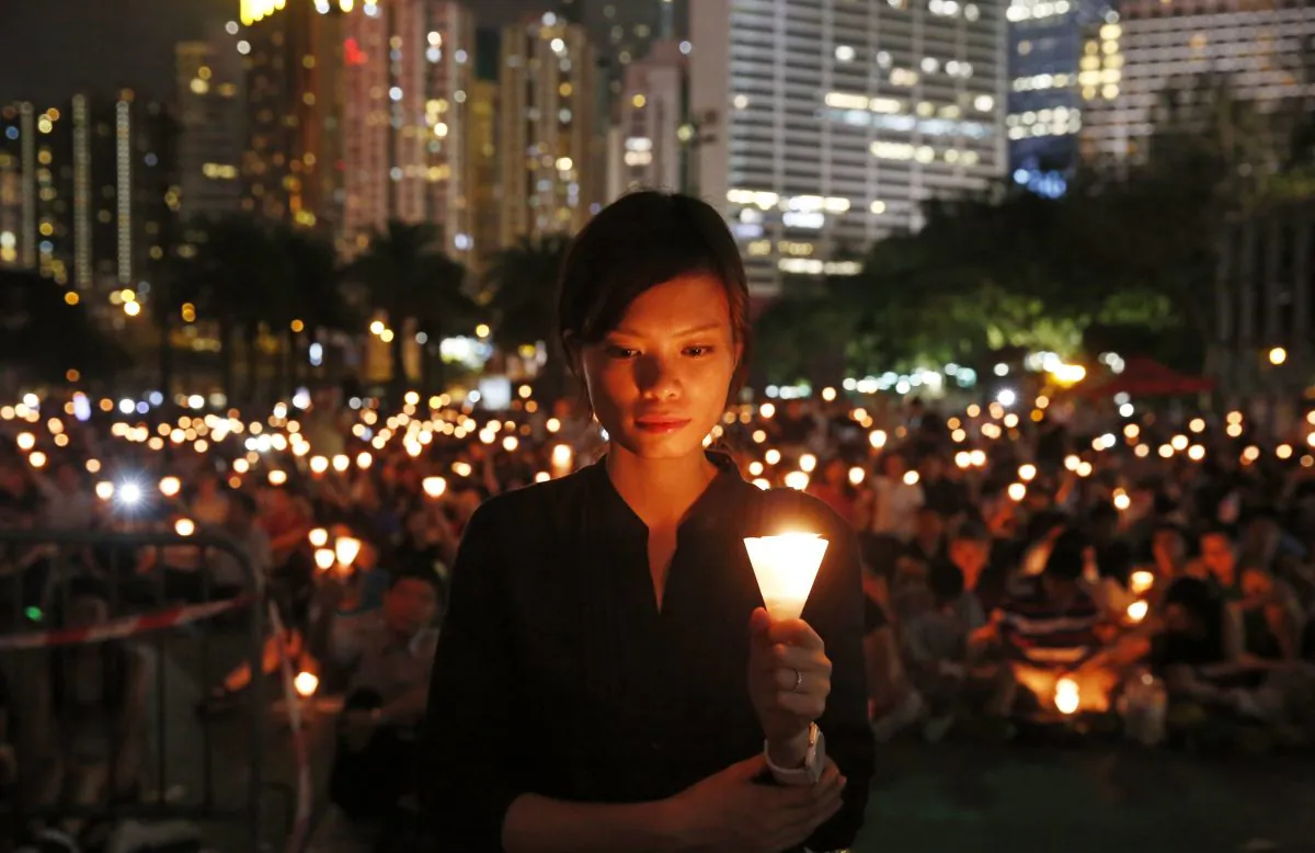 Tens of thousands of people attend a candlelight vigil at Victoria Park in Hong Kong on June 4, 2015. (Kin Cheung/AP Photo)