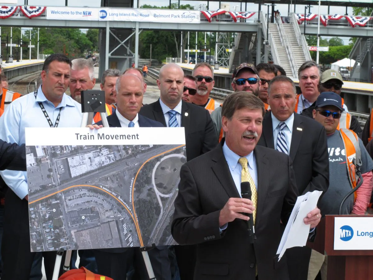 In this photo taken Thursday, June 4, 2015, Long Island Rail Road President Patrick Nowakowski speaks at a news conference at the opening of a renovated Belmont Park train station. (AP Photo/Frank Eltman)