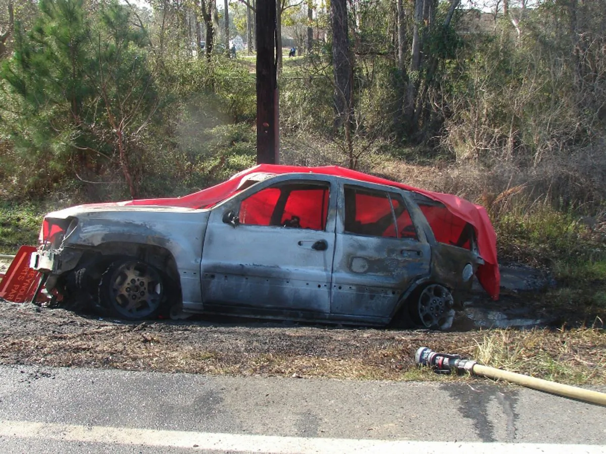 FILE - This March 6, 2012 file photo provided by the law offices of Butler, Wooten & Fryhofer, LLP shows a burnt-out Jeep Grand Cherokee at the scene of a crash in Bainbridge, Ga. (Courtesy of Butler, Wooten & Fryhofer, LLP via AP, File)