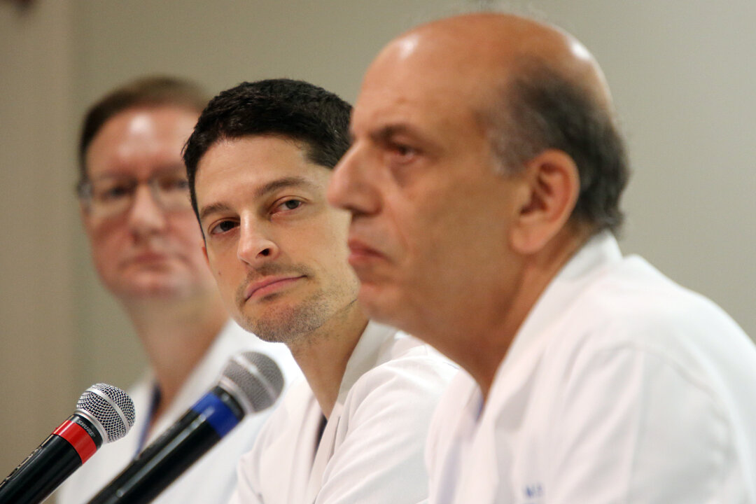 From left, Michael Kiebuc, MD, of Houston Methodist Hospital, Jesse C. Selber, MD, MPH, of MD Anderson Cancer Center, and A. Osama Gaber, MD, of Houston Methodist Hospital, describe the transplant surgery for Jim Boysen during a news conference at Houston Methodist Hospital on Thursday, June 4, 2015, in Houston. (Mayra Beltran/Houston Chronicle via AP)