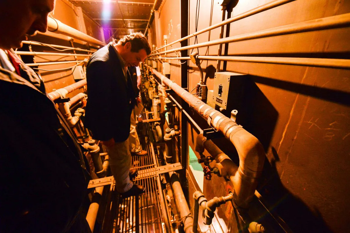 This photo provided by New York State Governor's office shows Gov. Andrew Cuomo on a catwalk looking into the cell that inmates escaped from at a maximum-security prison near the Canadian border in Dannemora, NY. (Darren McGee/New York State Governor's Office, via AP)