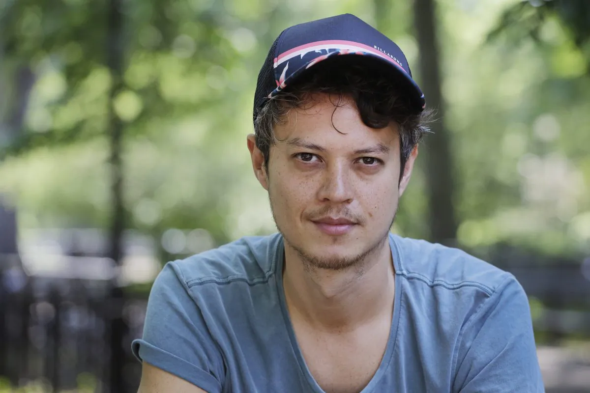 In this May 26, 2015 photo, freelance web designer Henry Brown poses for a portrait, in New York. (AP Photo/Mark Lennihan)