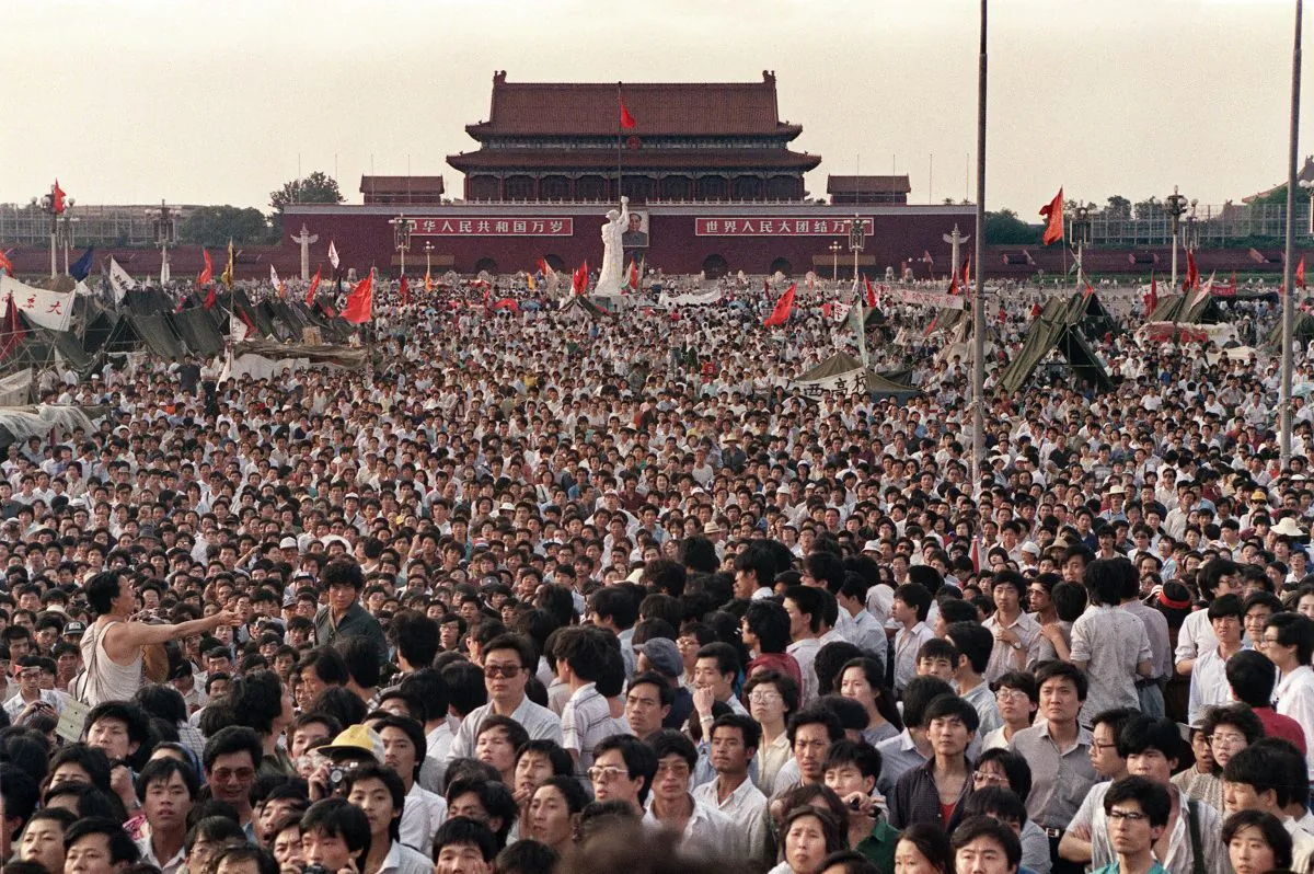 Hundreds of thousands of Chinese gather in Tiananmen Square around a 10-meter replica of the Statue of Liberty (C), called the Goddess of Democracy, on June 2, 1989. (Catherine Henriette/AFP via Getty Images)