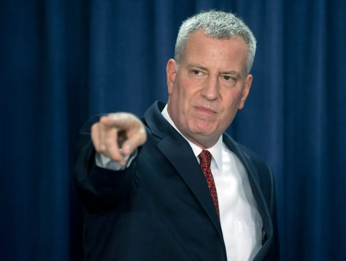 New York City Mayor Bill de Blasio takes a question during a news conference on Wednesday, May 27, 2015, in Albany, N.Y. De Blasio is in Albany to make his case for renewing mayoral control of city schools, strengthening the city's rent regulations and changing a tax break for real estate developers to require more affordable housing. (AP Photo/Mike Groll)