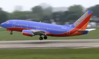 Southwest Flight Attendant Holds Crying Baby in Viral Video