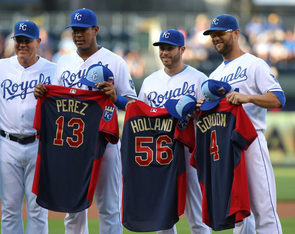 Royals manager Ned Yost (from L-R), catcher Salvador Perez, closer Greg Holland, and outfielder Alex Gordon all made the the All-Star team and are on pace to do the same this year—with plenty of company as the team is on pace to put start seven players. (Ed Zurga/Getty Images)