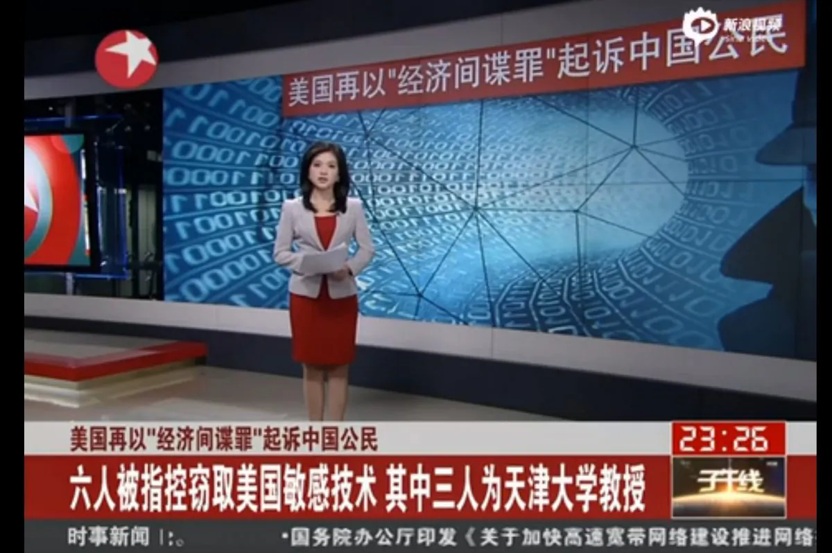 A news reader on Dragon Television, a Chinese TV station, presents the appeal by the Tianjin University Alumni Association for donations to the legal case for a Chinese professor indicted for espionage in the United States. (Screenshot via Sina)