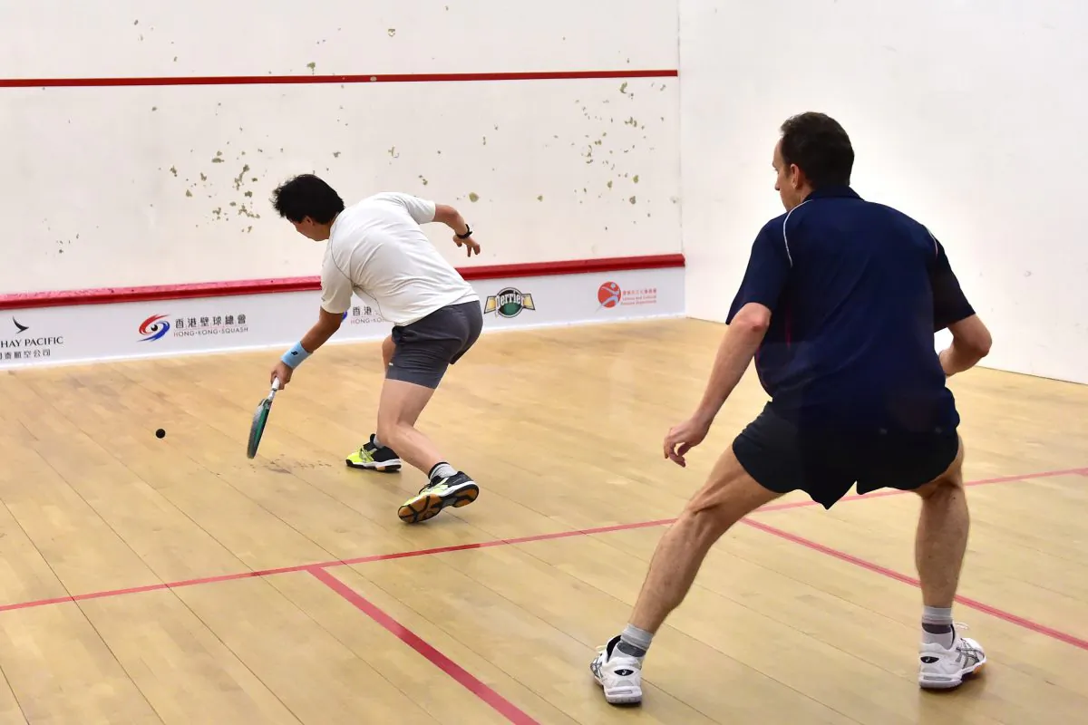 Peter Hill playing Hugh Dyus in the Final of the Mater’s D Championship Final on Saturday June 6, 2015. Hill a master of ball placement and deception won the match 11-3, 11-5, 12-10 to take the title. Hill a past World Masters winner moves on to compete in the 2015 Hong Kong National Championship this week. (Bill Cox/Epoch Times)