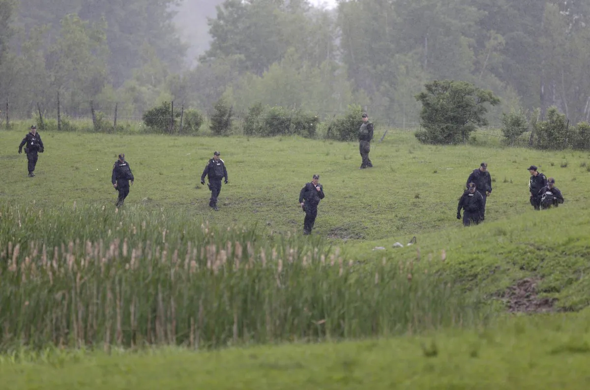 Law enforcement officers search for escaped prisoners near Essex, N.Y., Tuesday, June 9, 2015. State and federal law officers searching for two killers who used power tools to break out of a maximum-security prison poured into a small town 30 miles away Tuesday after getting a report of a possible sighting. (AP/Seth Wenig)